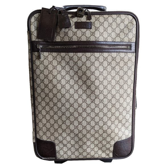 gucci supreme suitcase